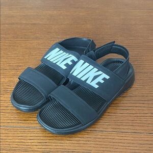Nike Black Sandals with Dual Straps and Textured Sole